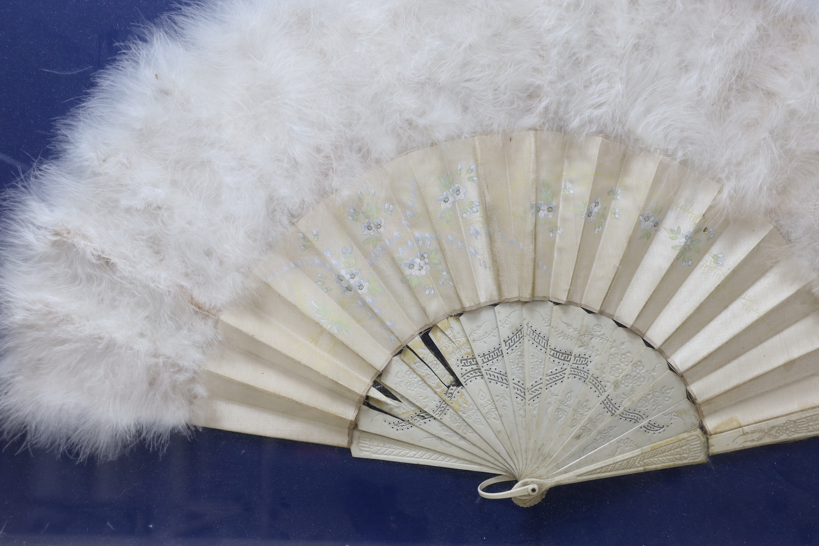 A cased bone, silk and swans down fan, 62cm wide